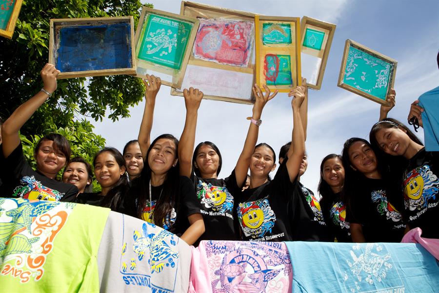ci_44958436 The "Friends of Environment Nature and Development Society" youth group making T-shirts — all with the message "Save the Sea Turtle."