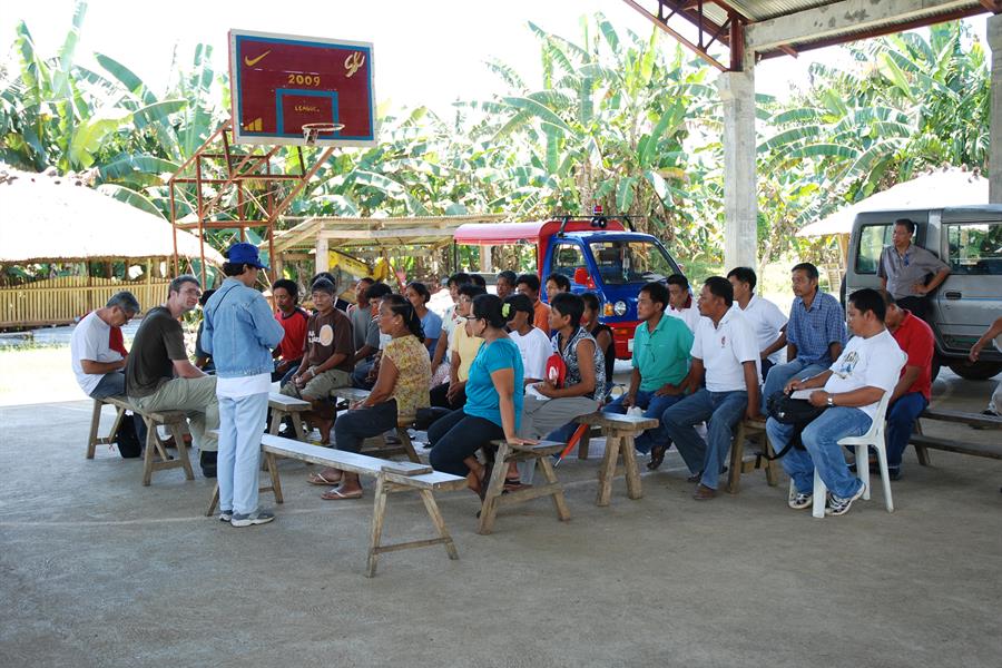 ci_46552408 Farmers and partners of the Quirino Forest Carbon project gather for a community meeting during the project validation process.