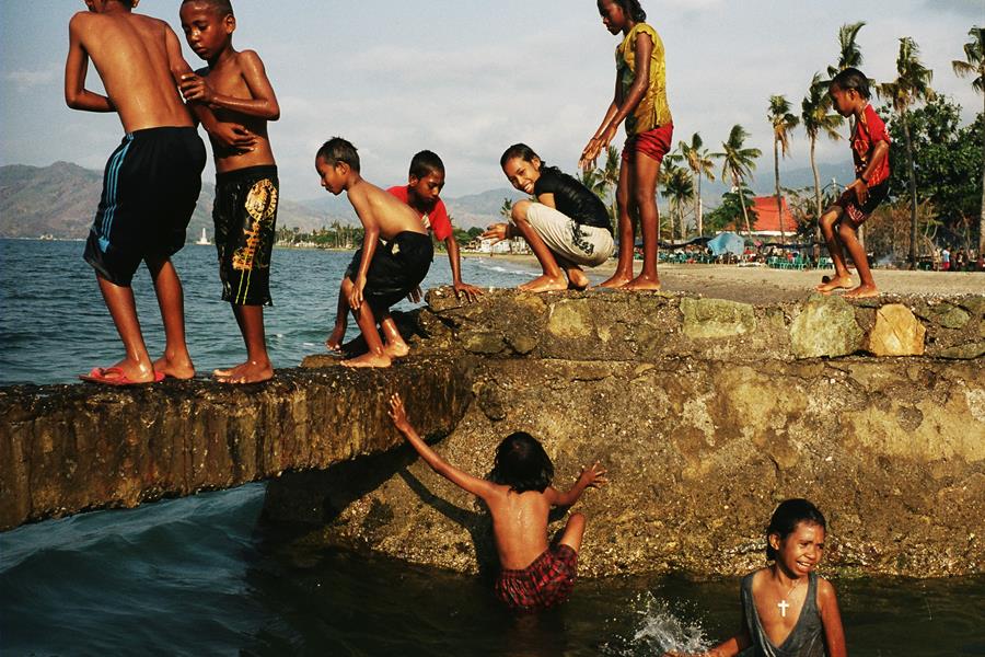ci_54024816 Timorese children playing in water