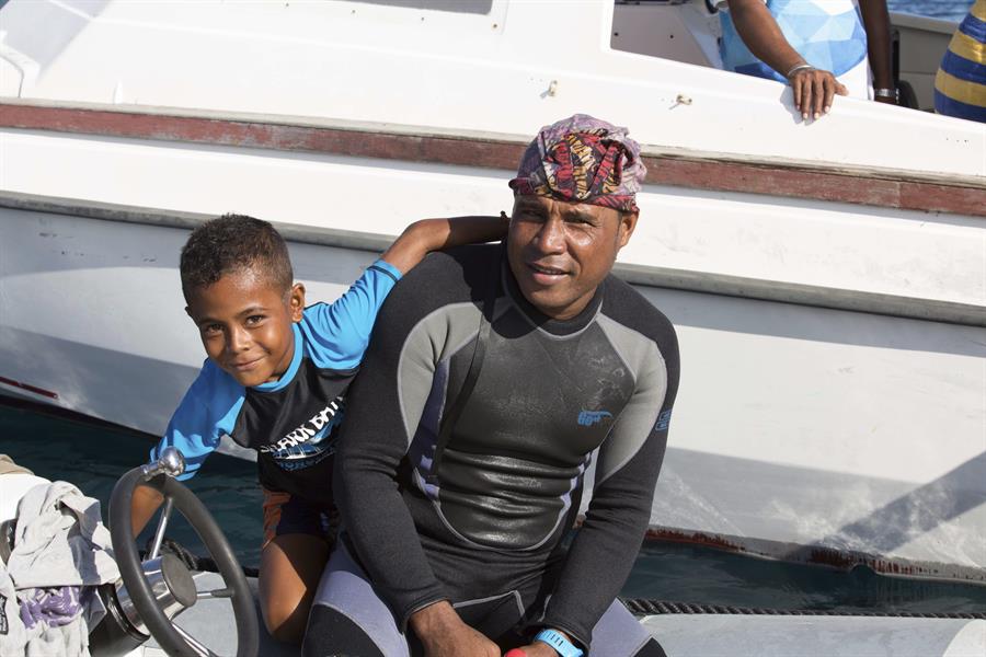 Ronald Mambrasar and his son Valen, the stars of Conservation International's VR debut, “Valen’s Reef," prepared to enter the water for filming.