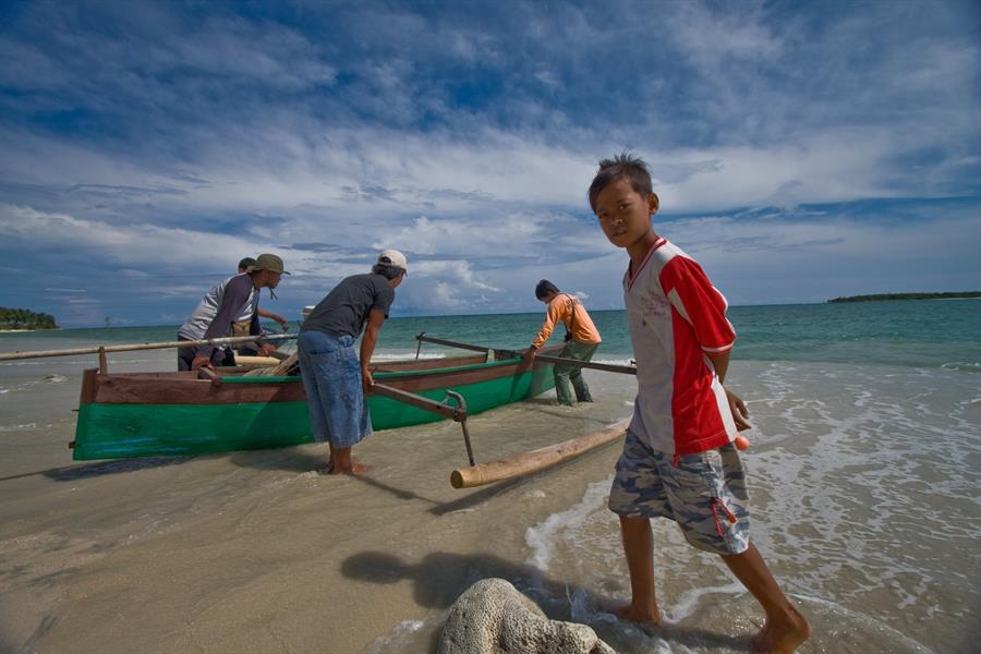 ci_84848319 A canoe is launched off the coast of Teku in Central Sulawesi, Indonesia.