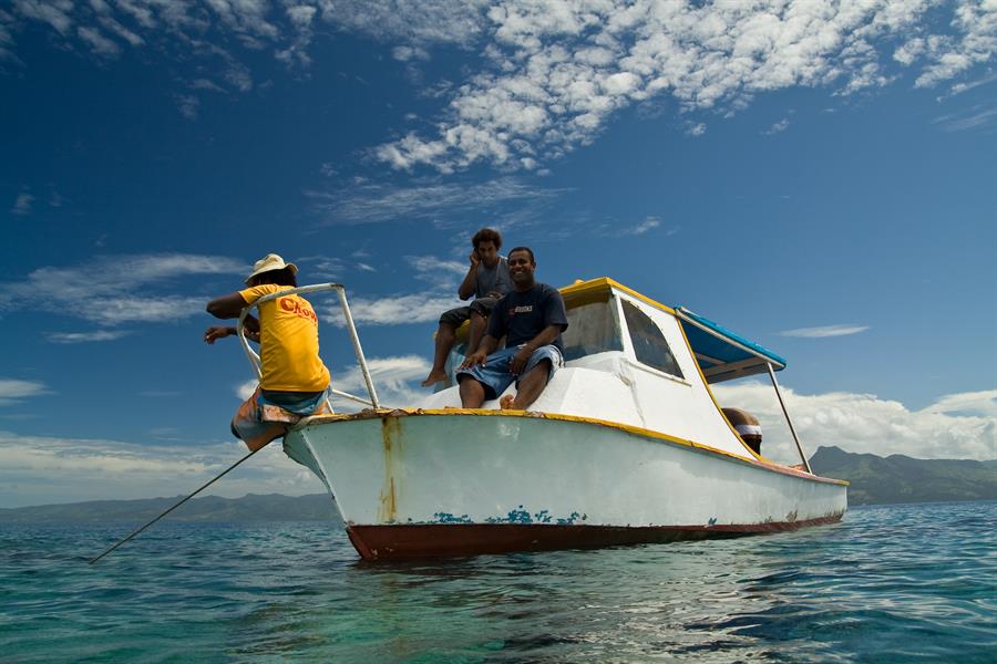 ci_93371814 Men diving from a boat off the coast of Viti Levu, Fiji, Oceania