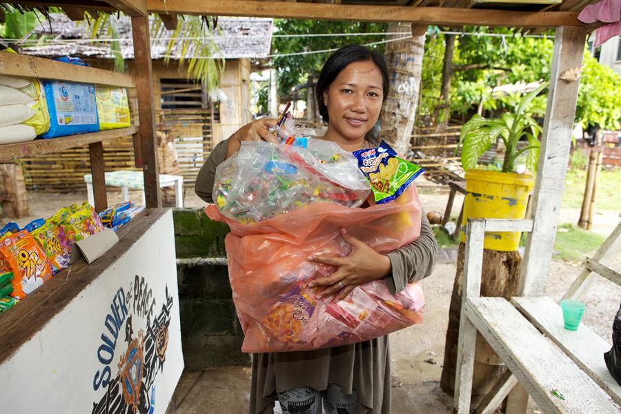 Woman holding recycling in the Philippines